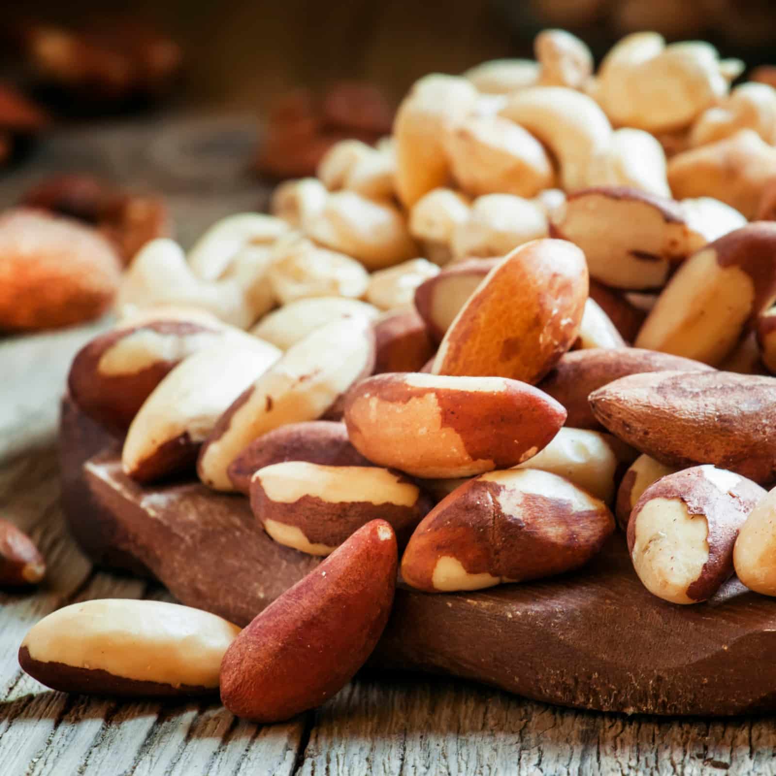 Brazilian nut, nut mix, vintage wooden background, selective foc